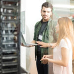 Colleagues discussing in office server room